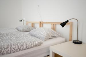 Postel nebo postele na pokoji v ubytování Residence Meljska