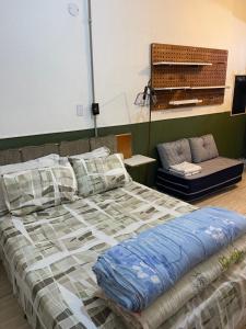 Cama o camas de una habitación en Loft Sé -Centro São Paulo