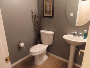 a bathroom with a toilet and a sink at Beautiful, spacious home in ABQ in Albuquerque