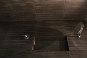 a shadow of a toilet in a shower stall at Chill Inn in Bernāti