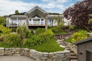 a house with a stone path leading up to it at Stonehill Villa in Queenstown