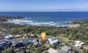 an aerial view of a resort near the ocean at Wave Cave Suite in Coffs Harbour