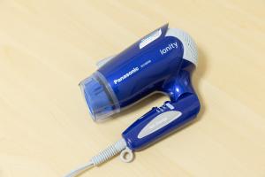 a blue hair dryer sitting on top of a table at Inoguchi View Heights in Itsukaichi
