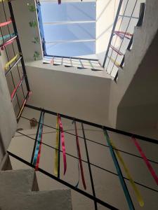 a group of ties hanging on a rail in a room at Leveli Coliving in Guadalajara