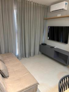 Apartamento Super Confortável tesisinde bir odada yatak veya yataklar