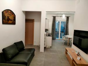 Телевизор и/или развлекательный центр в Trieste LIVING