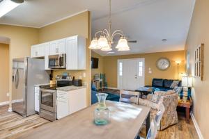 a kitchen and living room with a table and appliances at Lovely Emerald Isle Home, Walk to Beach! in Emerald Isle