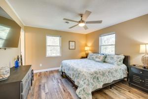 a bedroom with a bed and a ceiling fan at Lovely Emerald Isle Home, Walk to Beach! in Emerald Isle