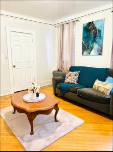 a living room with a couch and a coffee table at Muna’s Place in Newark