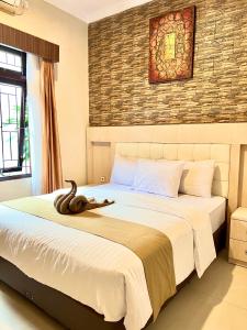 Voodi või voodid majutusasutuse Ayuri Hotel Malioboro toas