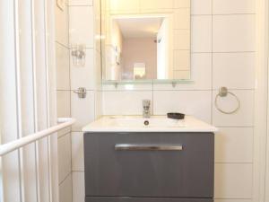 a bathroom with a sink and a mirror at Appartement T2 avec clim, parking et wifi - Balaruc-les-Bains - FR-1-553-241 in Balaruc-les-Bains