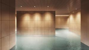 a hallway with a pool of water in a building at Mitsui Garden Hotel Kyoto Sanjo PREMIER in Kyoto
