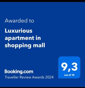 a screenshot of a phone with the text awarded to luxurious appointment in shopping mall at Entire Luxurious Apartment in Shopping Mall in Mexico City