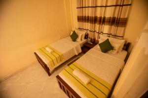Postel nebo postele na pokoji v ubytování Evergreen Hotel Dambulla