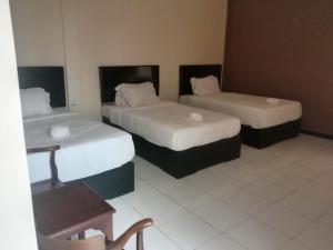 Postel nebo postele na pokoji v ubytování Dya Hotel Boyolali