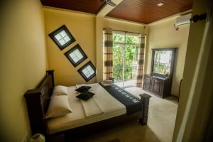 Postel nebo postele na pokoji v ubytování Evergreen Hotel Dambulla