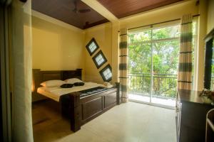 Postel nebo postele na pokoji v ubytování Evergreen Hotel Dambulla