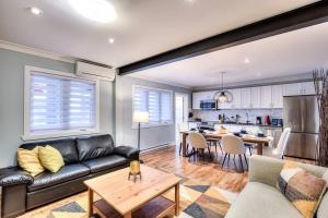 a living room with a couch and a table at Charming 2BR with Balcony in Montreal in Montreal