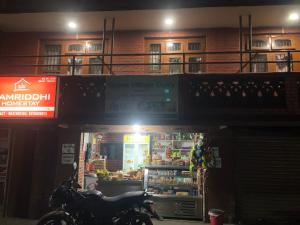 a motorcycle parked in front of a store at night at Samriddhi HomeStay in Kathmandu