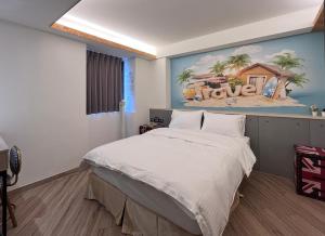 A bed or beds in a room at Good Time Boutique Hotel