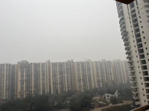 a view of a large city with tall buildings at Hello studio in Noida