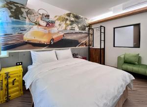 A bed or beds in a room at Good Time Boutique Hotel