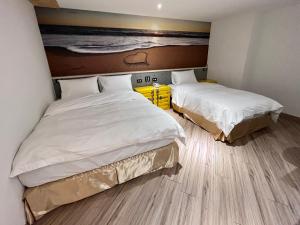 A bed or beds in a room at Good Time Boutique Hotel
