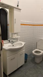 a bathroom with a sink and a toilet at The Gate to Cinque terre in La Spezia +29 photos
