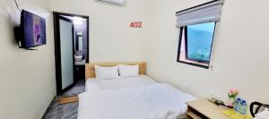 Postel nebo postele na pokoji v ubytování NHÀ NGHỈ ANH VĂN