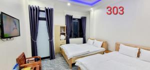 Postel nebo postele na pokoji v ubytování NHÀ NGHỈ ANH VĂN