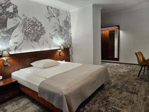 Postel nebo postele na pokoji v ubytování Villa Intryga