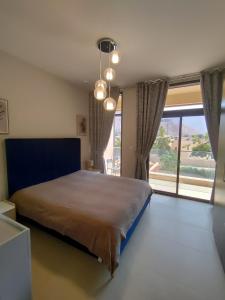 Tempat tidur dalam kamar di Apartment, Muscat Bay