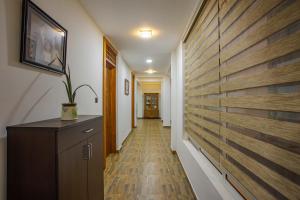 a hallway with a wooden wall in a house at Anu - The Breeze of Heaven in Kandy