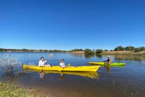 a group of people in kayaks on a river at Khomas Hochland Chalet in Prospect