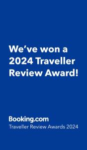 a blue sign with the words weve won a traveller review award at Hotel Haus Loewe in Frechen