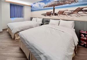 A bed or beds in a room at Good Time Boutique Hotel