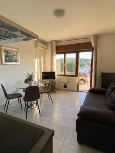 a living room with a couch and a table at Apartment Kate in Trogir