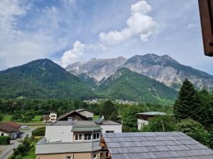 a view of a mountain range from a house at Chalet Claudia in Bartholomäberg