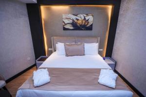 Postel nebo postele na pokoji v ubytování Arium Hotel Baku