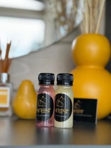 two jars of spices sitting on a counter with fruit at Mirest - котедж в горах із чаном-джакузі in Slavske