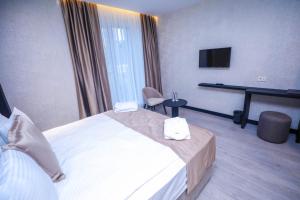 Postel nebo postele na pokoji v ubytování Arium Hotel Baku