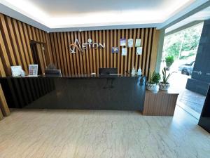 a lobby with a reception desk in a building at Aeton Hotel Nilai in Nilai