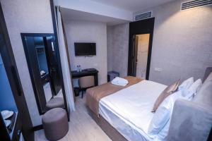 Postel nebo postele na pokoji v ubytování Arium Hotel Baku
