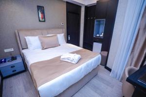 Postel nebo postele na pokoji v ubytování Arium Hotel Baku