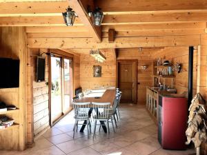 a kitchen and dining room with a table and chairs at Chalet Gaspard - Chalets pour 16 Personnes 494 in Vénosc
