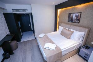 Postel nebo postele na pokoji v ubytování Arium Hotel Baku