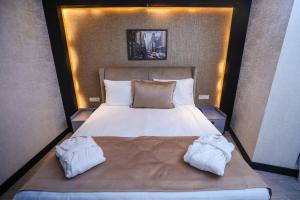 Postel nebo postele na pokoji v ubytování Arium Hotel Baku