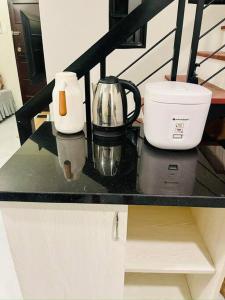 a counter top with a coffee maker and a blender at Modern Home in Lakeshore Mexico, Pampanga in Mexico