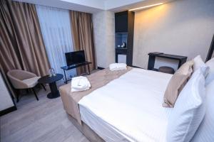 Postel nebo postele na pokoji v ubytování Arium Hotel Baku