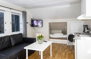a living room with a couch and a table at Lillehammer Camping in Lillehammer